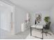 Modern home office featuring clean lines, white shelving, and a comfortable work space at 777 3Rd N Ave # 905, St Petersburg, FL 33701