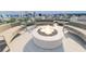 Inviting outdoor lounge area with a fire pit, comfortable seating, and panoramic city views for relaxing gatherings at 777 3Rd N Ave # 905, St Petersburg, FL 33701