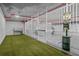 Indoor pet waste station featuring artificial grass, wash area, and waste disposal at 777 3Rd N Ave # 905, St Petersburg, FL 33701