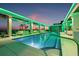 Rooftop pool featuring an inviting oasis with lounge chairs and lush landscaping against a colorful sky at 777 3Rd N Ave # 905, St Petersburg, FL 33701