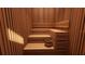 Relaxing wood-paneled sauna room with tiered seating and calming ambiance for ultimate relaxation at 777 3Rd N Ave # 905, St Petersburg, FL 33701