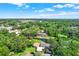 Beautiful aerial view of a neighborhood surrounded by lush greenery and serene ponds under a blue sky at 8630 Cattail Dr # 8630, Temple Terrace, FL 33637