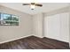 Bedroom featuring a window, ceiling fan, and a closet at 8630 Cattail Dr # 8630, Temple Terrace, FL 33637