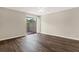 Bright bedroom featuring wood-look flooring and sliding glass doors to outdoor patio at 8630 Cattail Dr # 8630, Temple Terrace, FL 33637