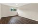 Spacious bedroom showcasing wood-look floors, a ceiling fan and natural light from a window at 8630 Cattail Dr # 8630, Temple Terrace, FL 33637