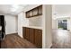 Kitchen with wood cabinets and hardwood-style flooring at 8630 Cattail Dr # 8630, Temple Terrace, FL 33637
