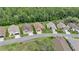 This aerial view shows a well-maintained, tree-lined neighborhood with beautiful homes at 9735 Conservation Dr, New Port Richey, FL 34655