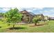 Landscaped backyard with a screened-in lanai and plenty of green space at 9735 Conservation Dr, New Port Richey, FL 34655