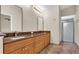 Bathroom with double vanity, granite counters, and shower with glass door at 9735 Conservation Dr, New Port Richey, FL 34655