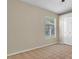 Cozy bedroom with a window, carpet, and a closet for convenient storage at 9735 Conservation Dr, New Port Richey, FL 34655