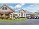 The clubhouse has beautiful architecture, landscaping, and convenient golf cart parking at 9735 Conservation Dr, New Port Richey, FL 34655