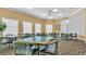 Bright game room with tables and chairs, perfect for social gatherings and activities at 9735 Conservation Dr, New Port Richey, FL 34655