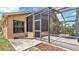 Screened in patio featuring a concrete floor and views of the backyard at 9735 Conservation Dr, New Port Richey, FL 34655
