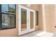 Covered patio featuring double doors leading inside and tile flooring at 9735 Conservation Dr, New Port Richey, FL 34655