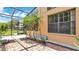Screened in patio featuring brick flooring and views of the backyard at 9735 Conservation Dr, New Port Richey, FL 34655