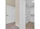 Walk-in closet with custom shelves and drawers for optimal organization at 9735 Conservation Dr, New Port Richey, FL 34655
