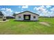 Exterior view of a charming barn on a sunny day at 9780 Allen Rd, Lithia, FL 33547
