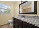Updated bathroom with granite countertop and a modern vanity at 9780 Allen Rd, Lithia, FL 33547