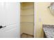 Walk-in closet with built-in shelving for ample storage at 9780 Allen Rd, Lithia, FL 33547
