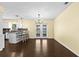 Open dining area with wood floors and backyard views from the French doors at 9780 Allen Rd, Lithia, FL 33547