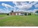 Inviting single story home with a well-manicured lawn and a two-car garage at 9780 Allen Rd, Lithia, FL 33547