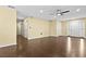 Spacious living room with wood-look floors and ceiling fan, perfect for relaxing and entertaining at 9780 Allen Rd, Lithia, FL 33547