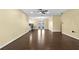 Open-concept living room with hardwood floors, ceiling fan, and views of the backyard at 9780 Allen Rd, Lithia, FL 33547
