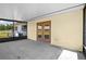 Covered patio with double doors, perfect for outdoor living at 9780 Allen Rd, Lithia, FL 33547