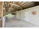 Covered stall area with concrete floors, multiple stalls, and adjacent RV parking providing versatile space at 9780 Allen Rd, Lithia, FL 33547