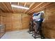 Tack room featuring wood paneled walls and ample storage space for saddles, bridles and other equestrian equipment at 9780 Allen Rd, Lithia, FL 33547