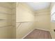 Walk-in closet featuring adjustable wire shelving for organized storage, and neutral carpeting at 9780 Allen Rd, Lithia, FL 33547