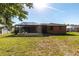Well-maintained backyard with a screened-in patio, offering a private outdoor space for relaxation and entertainment at 3254 Great Neck St, Port Charlotte, FL 33952