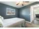 Bedroom features a ceiling fan, neutral carpet, and a window for natural light at 3254 Great Neck St, Port Charlotte, FL 33952