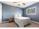 Cozy bedroom features a comfortable bed, soft carpet, and a ceiling fan at 3254 Great Neck St, Port Charlotte, FL 33952