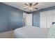 Comfortable bedroom with neutral colors, ceiling fan, and closet space at 3254 Great Neck St, Port Charlotte, FL 33952