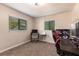 Bedroom with two windows, a desk with a computer, and sports memorabilia at 3254 Great Neck St, Port Charlotte, FL 33952