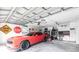 Spacious garage featuring a car, storage cabinets, and various accessories, providing ample space for vehicles and organization at 3254 Great Neck St, Port Charlotte, FL 33952