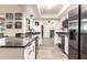 Modern kitchen features sleek granite countertops, stainless steel appliances, and wood-look flooring at 3254 Great Neck St, Port Charlotte, FL 33952