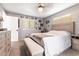 Comfortable bedroom boasts a ceiling fan, neutral carpet, and lots of wall decorations at 3254 Great Neck St, Port Charlotte, FL 33952