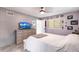 Cozy bedroom features a ceiling fan, neutral carpet, and calming gray paint at 3254 Great Neck St, Port Charlotte, FL 33952