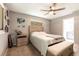 Relaxing bedroom with ensuite bathroom access, ceiling fan, and neutral décor at 3254 Great Neck St, Port Charlotte, FL 33952
