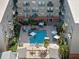An aerial view captures the refreshing courtyard pool surrounded by inviting lounge areas and seating at 1010 Central Ave # 227, St Petersburg, FL 33705