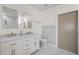 Bright bathroom featuring double sink vanity with marble countertop and a large mirror at 1010 Central Ave # 227, St Petersburg, FL 33705