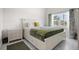 Bedroom with large window, stylish curtains, and view to the outside at 1010 Central Ave # 227, St Petersburg, FL 33705