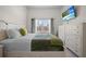 Bedroom with large window, tv and view to the outside at 1010 Central Ave # 227, St Petersburg, FL 33705