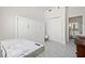 Bedroom with marble floors, murphy bed, and ensuite bathroom at 1010 Central Ave # 227, St Petersburg, FL 33705