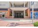 Building entrance featuring modern architectural design, brick accents, and prominent numerical signage at 1010 Central Ave # 227, St Petersburg, FL 33705