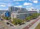 An exterior showcases the property's corner location, with landscaping, balconies, and convenient bus access at 1010 Central Ave # 227, St Petersburg, FL 33705