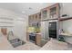 Well lit kitchen featuring stainless steel appliances, granite counters, and glass-front cabinets at 1010 Central Ave # 227, St Petersburg, FL 33705