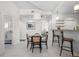 Open-concept kitchen and living area with a dining table and modern decor for seamless entertaining at 1010 Central Ave # 227, St Petersburg, FL 33705